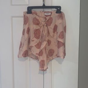 Blush pink flowy shorts with bow on front